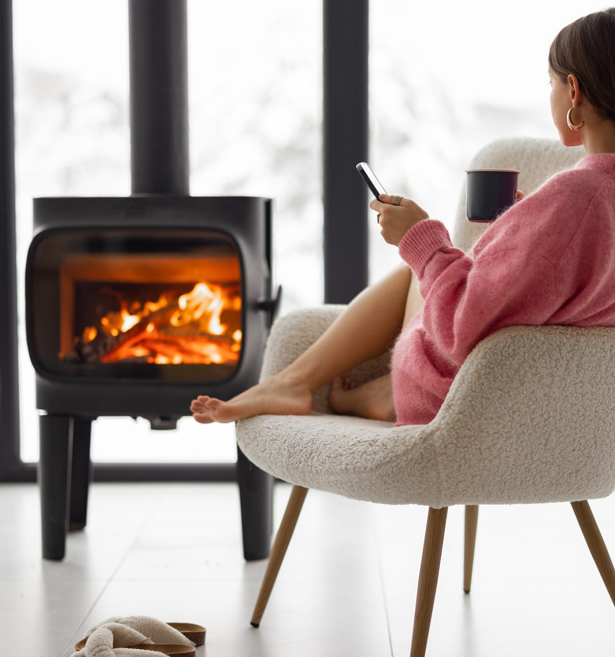 KAD Build house building company woman with cup on a chair inside new house New Zealand